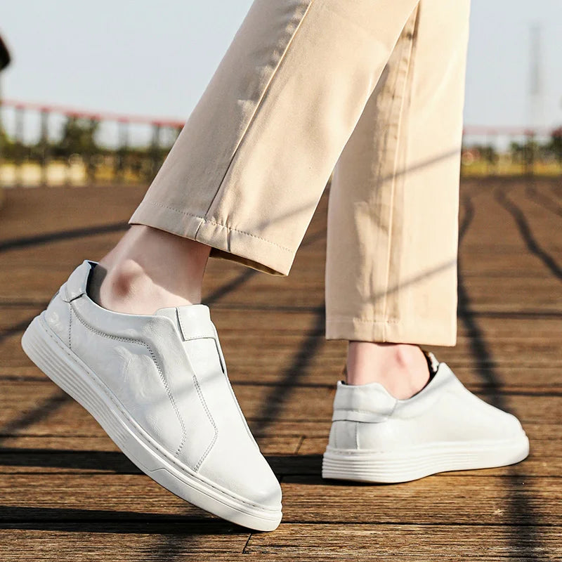 Alvio genuine leather slip-on shoes in white, designed for comfort and daily wear, showcasing a smooth exterior.