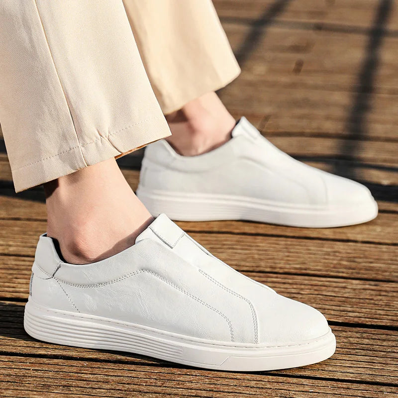 Alvio Genuine Leather Slip-On Shoes in white, featuring a cushioned footbed and designed for daily comfort and style.