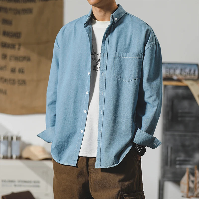 Frontier denim jacket in light blue, featuring a clean design and subtle distressing for everyday wear.