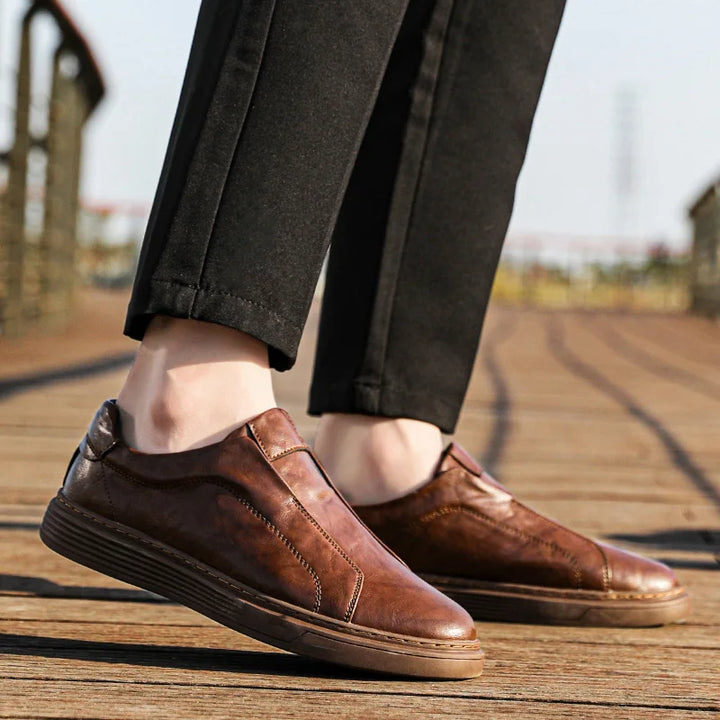 Alvio Genuine Leather Shoes in brown, showcasing slip-on design and cushioned footbed for all-day comfort.
