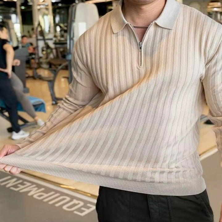 Model showcasing the Jay Flex-Fit Shirt in a gym setting, highlighting its muscle-shaping ribbed texture and athletic fit.