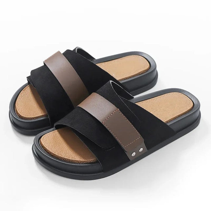 Mojave Men's Suede Slides in black with leather accents, featuring thick sole for impact cushioning and reinforced construction.