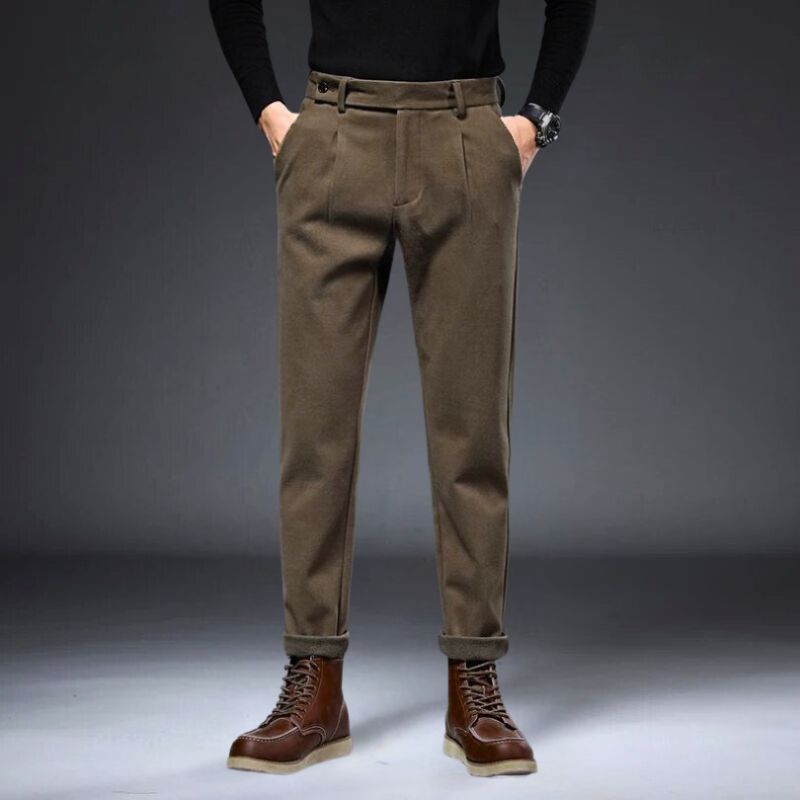 Hudson tailored trousers in brown with a refined fit, stylishly paired with leather boots, showcasing a polished look.