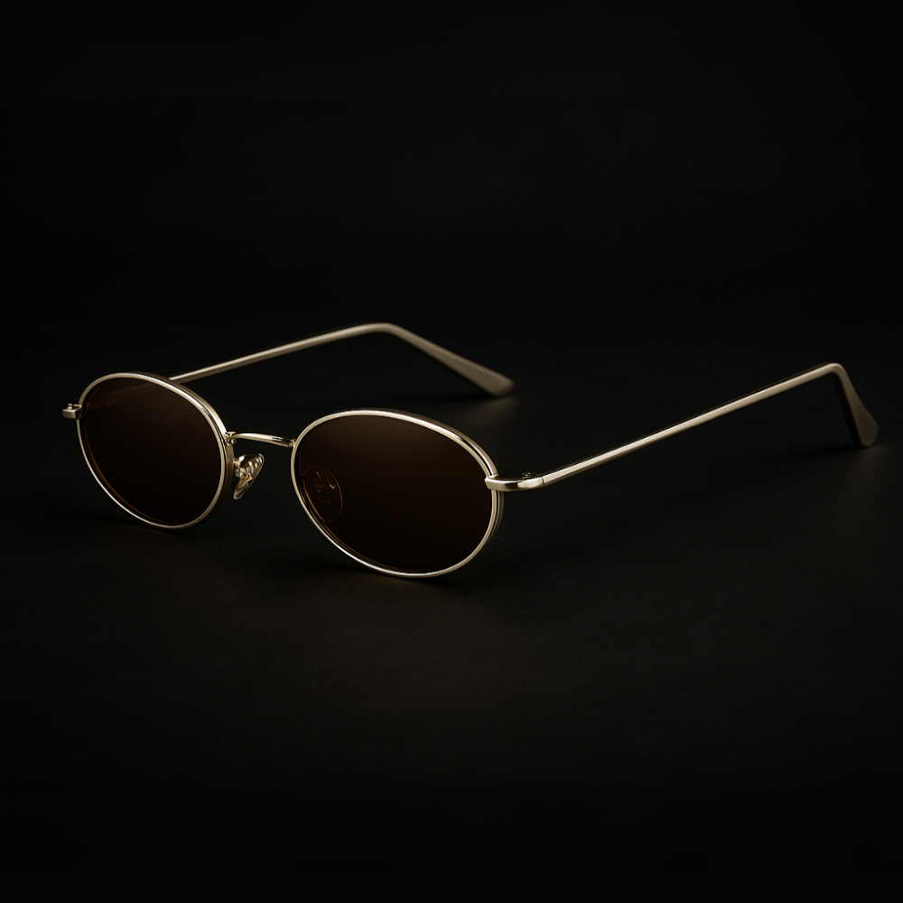 Orin Oval Frame Sunglasses with polished metallic finish and dark lenses; stylish, durable, and comfortable with UV400 protection.