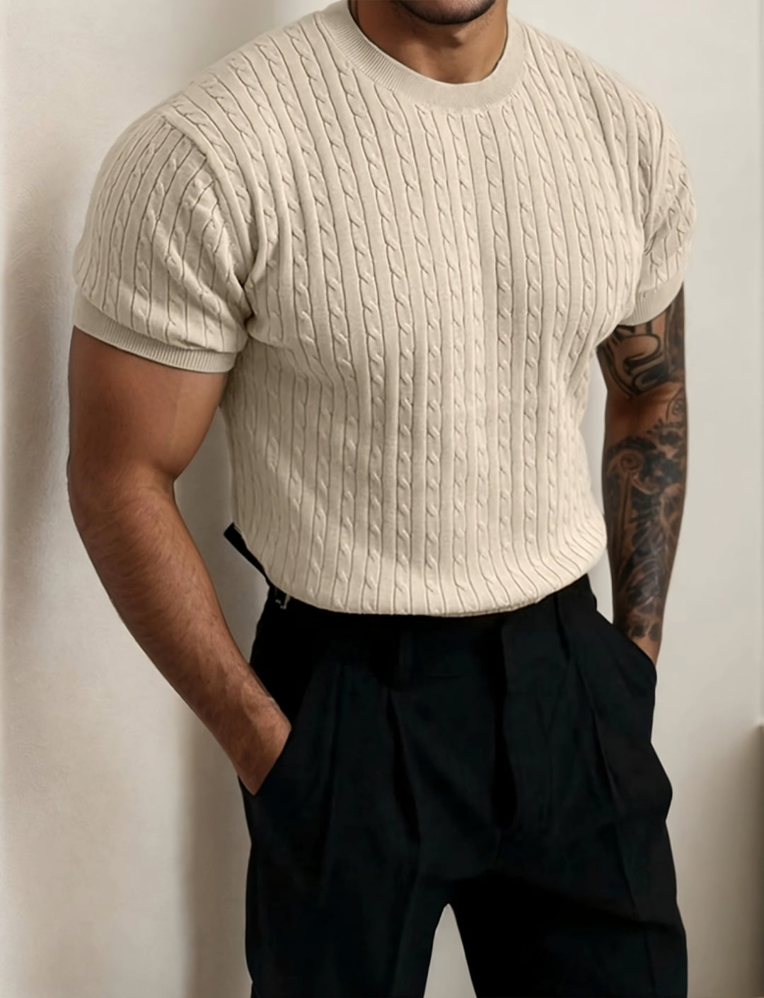 Man wearing a beige ribbed fitted t-shirt, showcasing a stylish and comfortable look.
