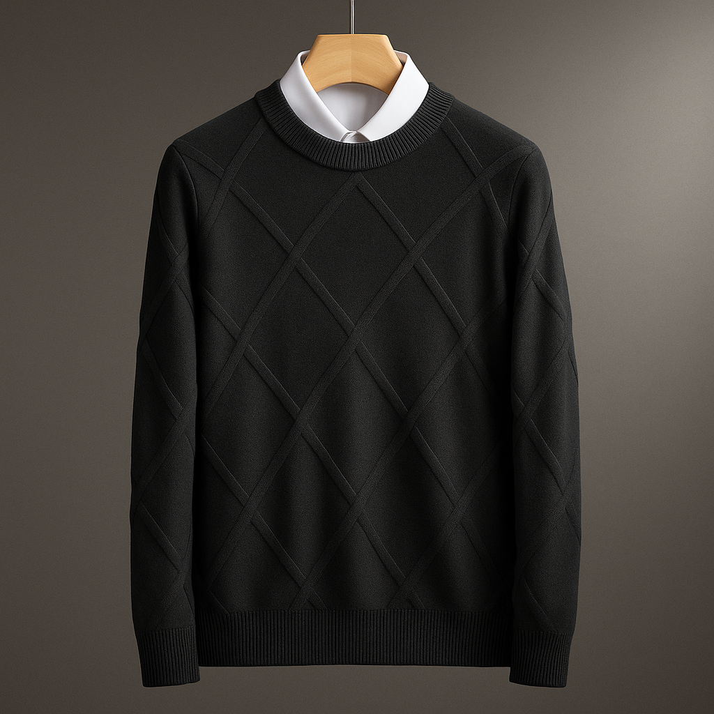 Black diamond-patterned sweater on a wooden hanger against a gray background