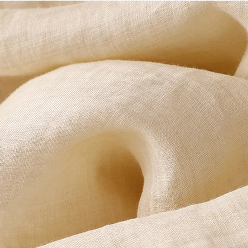 Soft and breathable cotton-linen fabric showing its airy texture, ideal for warm-weather clothing.
