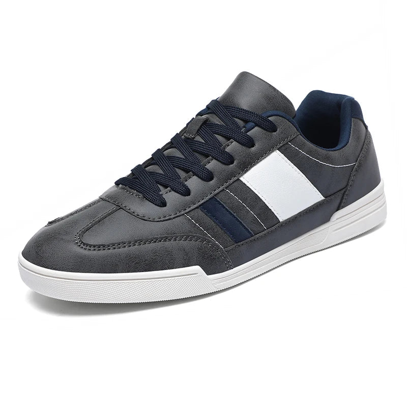 Rival Sport Sneakers in gray with navy and white contrast paneling, featuring a low-profile silhouette and cushioned insole.