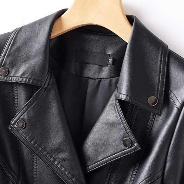 Black leather jacket on a hanger with a visible brand label.