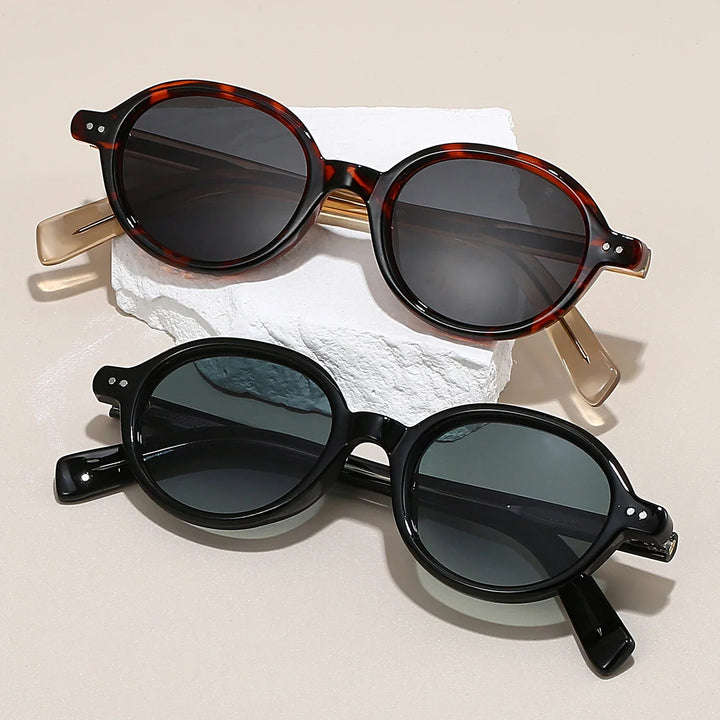 Sable Round Sunglasses in tortoiseshell and black frames with UV-blocking tinted lenses, showcasing bold design and ergonomic comfort.
