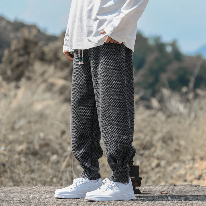 Oslo Textured Joggers in grey with a relaxed fit and adjustable drawstring waist, paired with casual white sneakers.