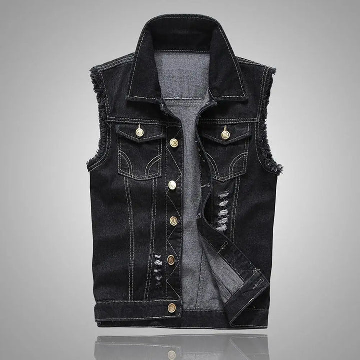 Knox Denim Vest in heavy distressed black denim with raw-edge armholes and classic button-front design.