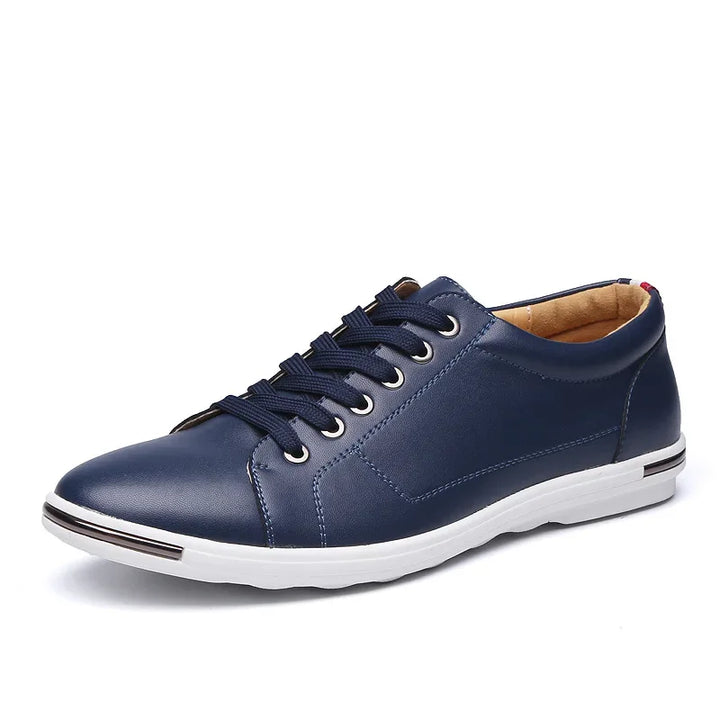 Paxton Low-Top Comfort Sneakers in navy blue leather with memory foam insoles and hidden lacing for versatile style.
