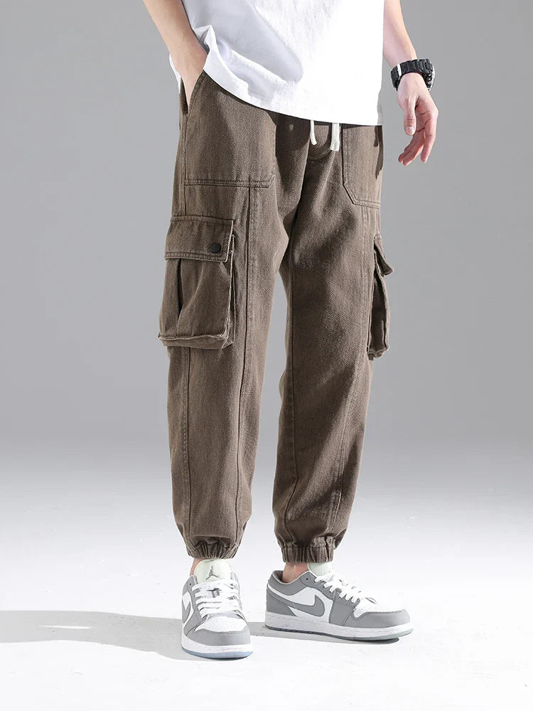Lennox Cargo Joggers in heavyweight cotton blend with snap pockets and elastic cuffs for a relaxed tapered fit.