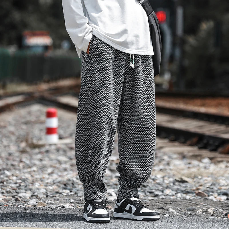 Oslo textured joggers featuring a relaxed fit, breathable fabric, and tapered cuffs, worn casually.