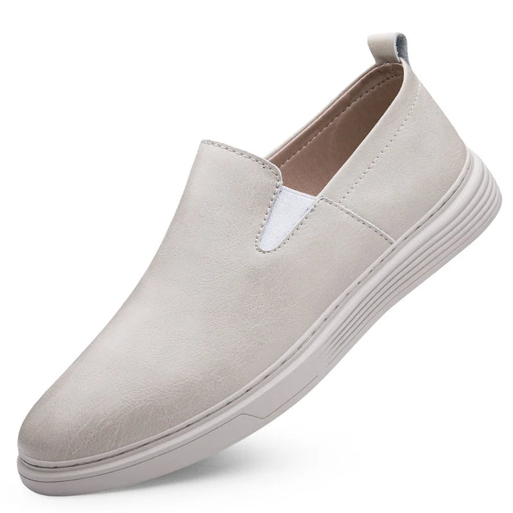 Duke Leather Slip-On Shoes in light grey, featuring cushioned sole and elastic side panels for comfort and versatility.
