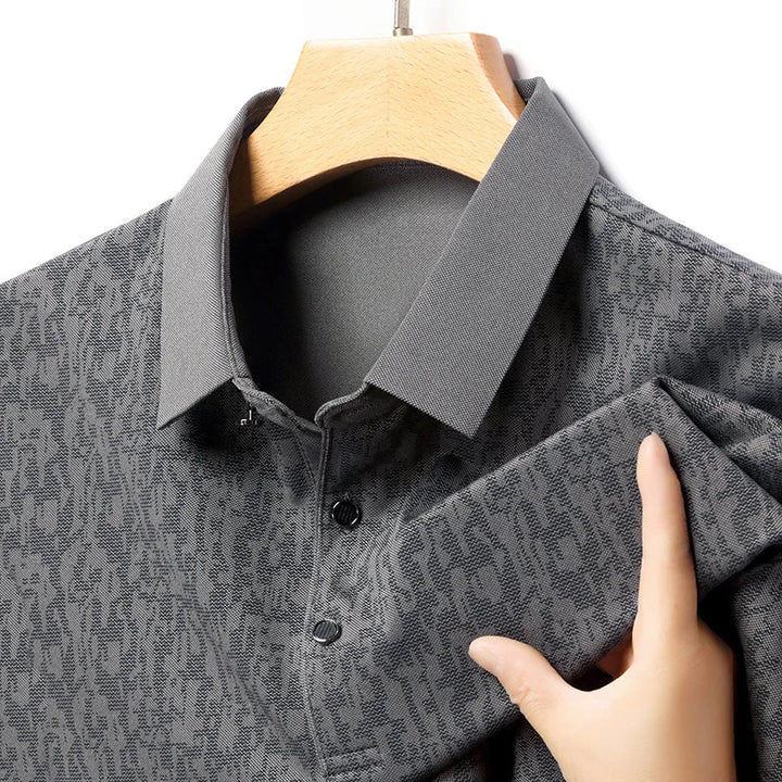 Auren Men's Jacquard Polo Shirt highlighting textured fabric, structured collar, and breathable design in a stylish gray color.