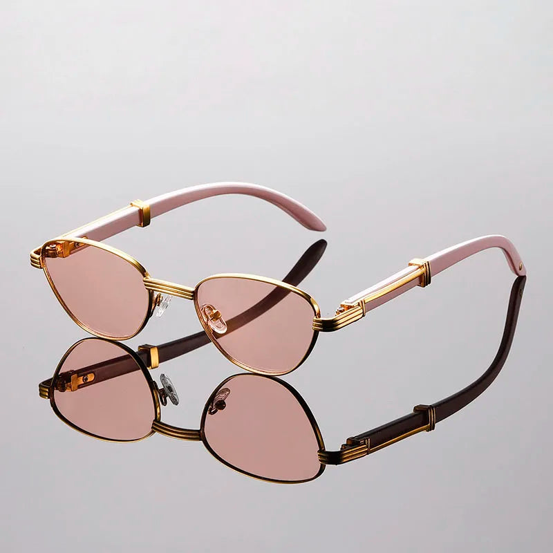 Orion Veil Sunglasses with gold-tone frames and gradient pink lenses, reflecting modern elegance and ergonomic comfort.