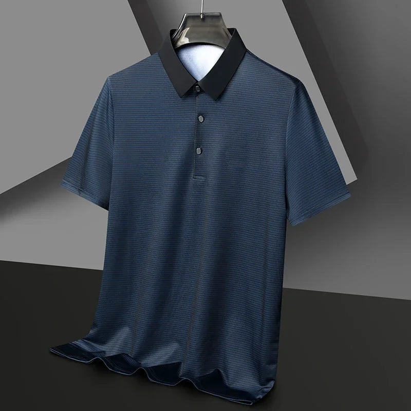 Eden Striped Polo in dark blue with contrast collar, showcasing a sleek, modern design and breathable stretch fabric.