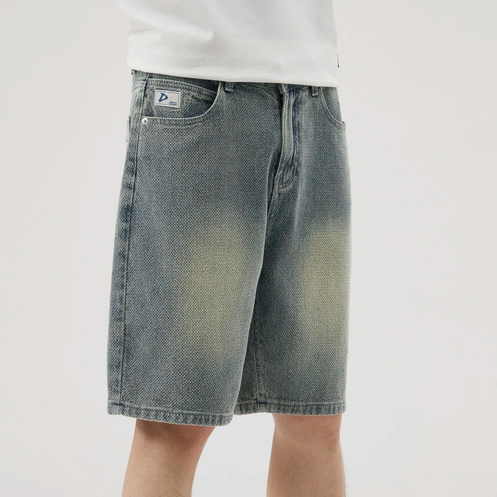 Men's Axel Faded Wash Denim Shorts featuring unique crosshatch weave and mid-length cut for a stylish streetwear look.
