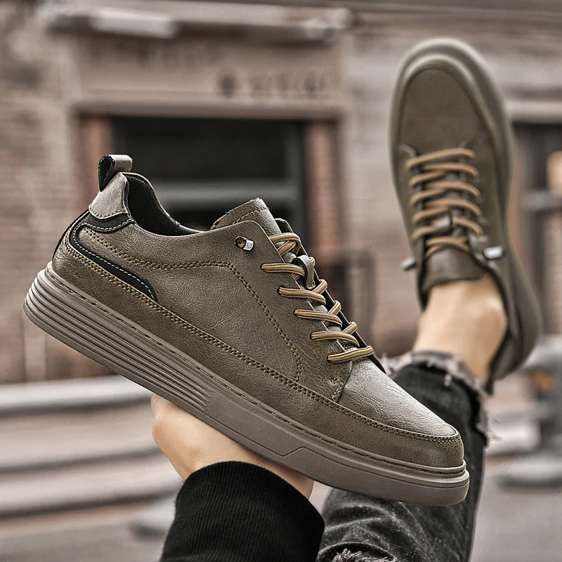 Genesis Leather Sneakers in grey with lace-up design, featuring a cushioned interior and durable rubber sole for comfort and style.