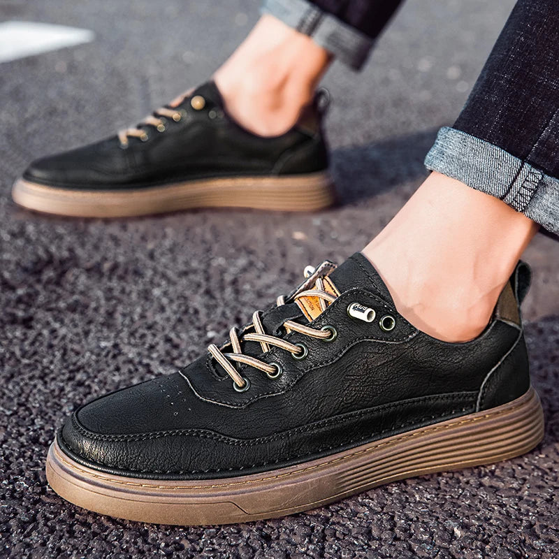 Alvo Genuine Leather Sneakers in black with artisanal hand-stitched details and a supportive sole for comfort.