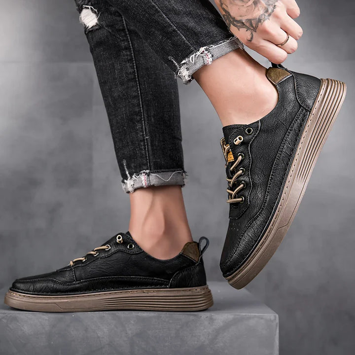 Alvo Genuine Leather Sneakers in black with hand-stitched detailing and supportive sole, perfect for everyday comfort.