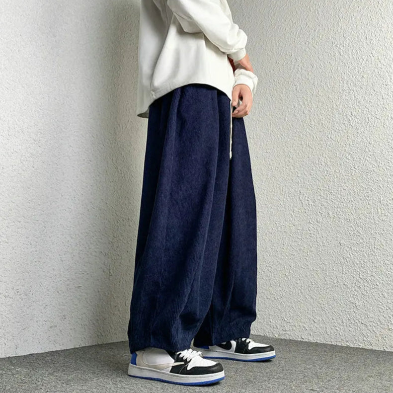 Arlo Corduroy Pants in a wide-leg fit, featuring a relaxed style with deep pockets and adjustable drawstring waist.