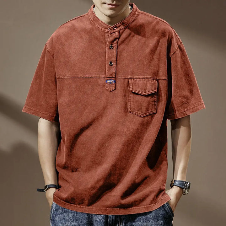 Orin Men's faded shirt in vintage red, featuring a mandarin collar, utility pocket, and asymmetrical placket design.