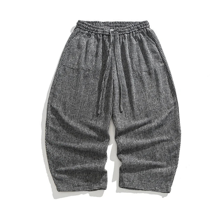 Henderson corduroy pants featuring a wide-leg fit, elastic waistband, deep pleats, and soft heavyweight corduroy texture.