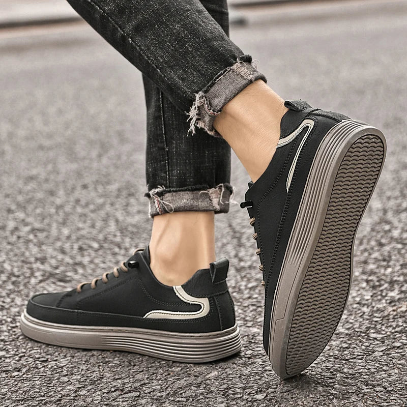 Genesis Leather Sneakers in black with a cushioned interior and durable rubber sole, perfect for versatile styling.