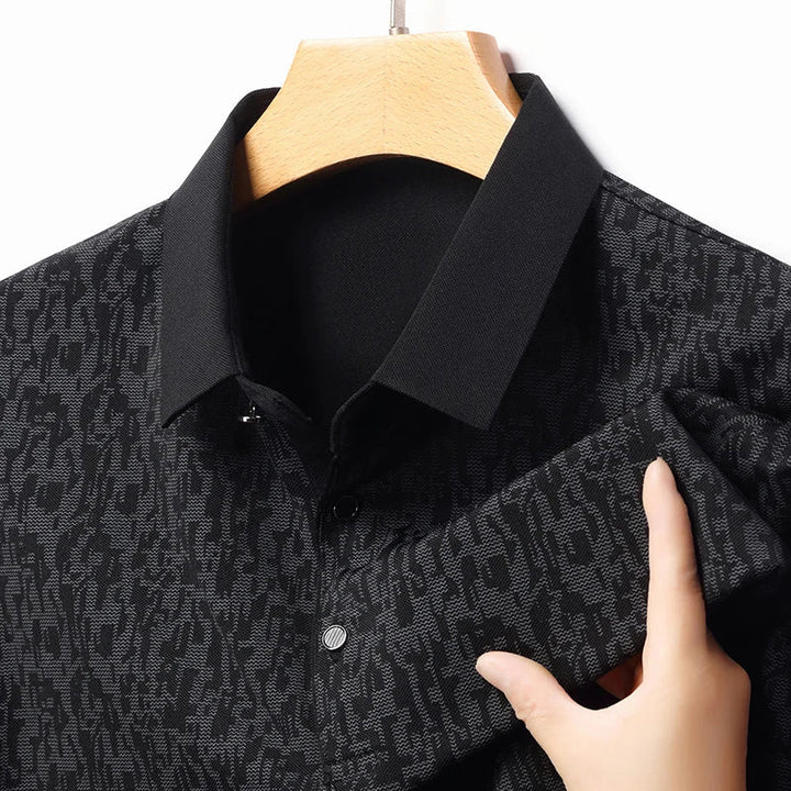 Auren Men's Jacquard Polo Shirt showcasing a textured black design and structured ribbed collar for comfort and style.