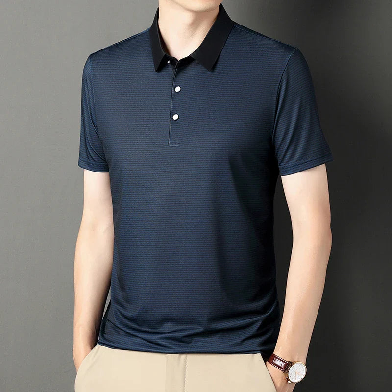 Eden Striped Polo featuring a modern navy micro-stripe design and bold contrast collar for a sharp, athletic look.