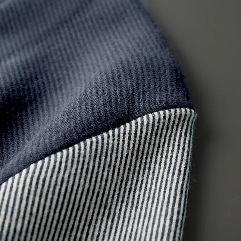 Close-up of ribbed contrast sleeve fabric on Rowan Merino Cardigan, showcasing soft merino wool textures.