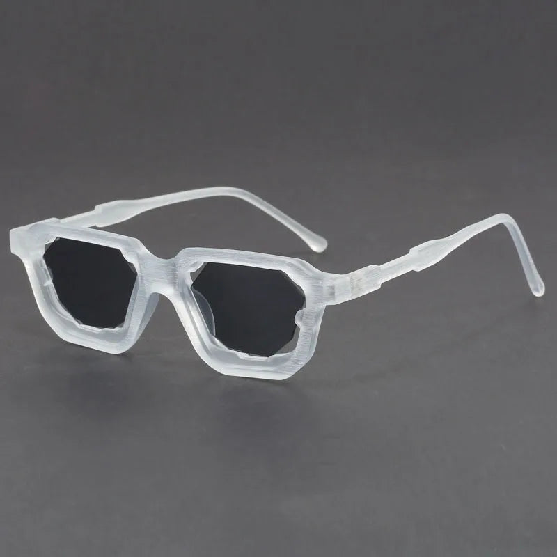 Vantor sunglasses with sharp geometric frame and thick sculpted edges, offering UV400 protection and ergonomic comfort.