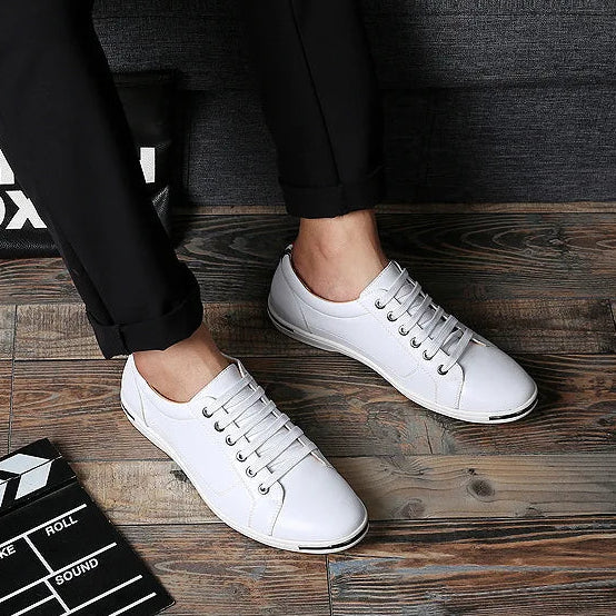 Paxton Low-Top Comfort Sneakers in white, featuring sleek leather upper and hidden eyelet lacing for a polished look.