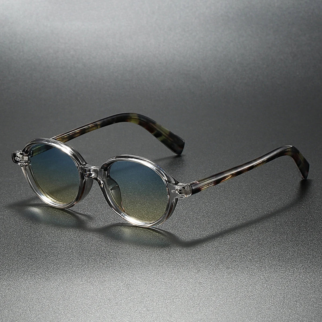 Sable Round Sunglasses with clear acetate frames and gradient UV-blocking lenses, stylish and durable for sunny days.