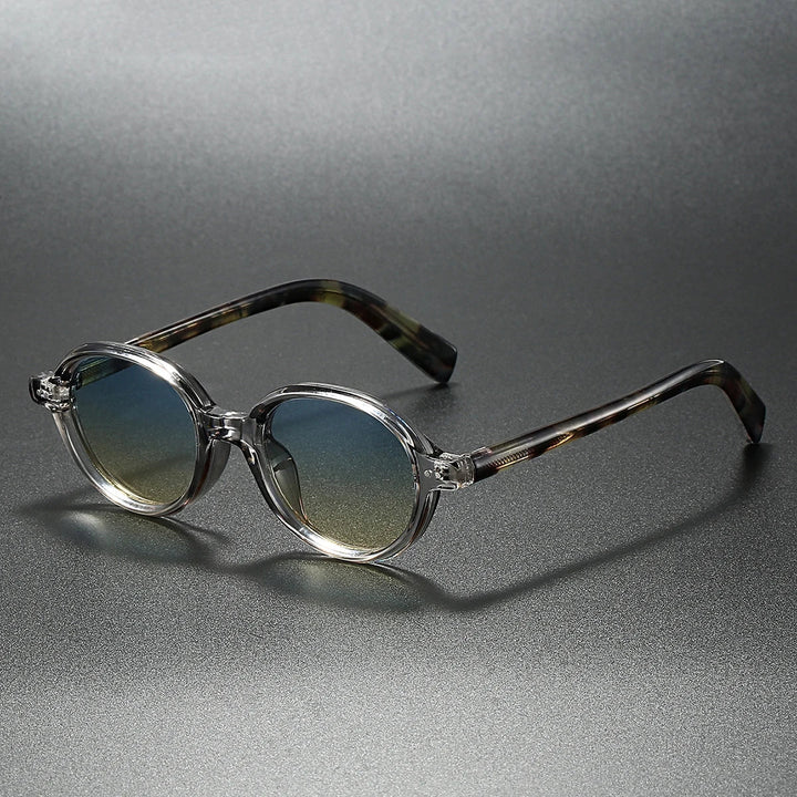 Sable Round Sunglasses with clear acetate frames and gradient UV-blocking lenses, stylish and durable for sunny days.