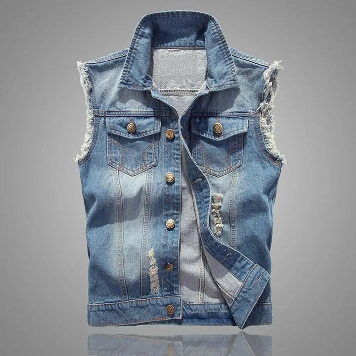 Knox Denim Vest with raw-edge design, sleeveless, heavy distressing, and dual flap pockets for a casual yet edgy look.