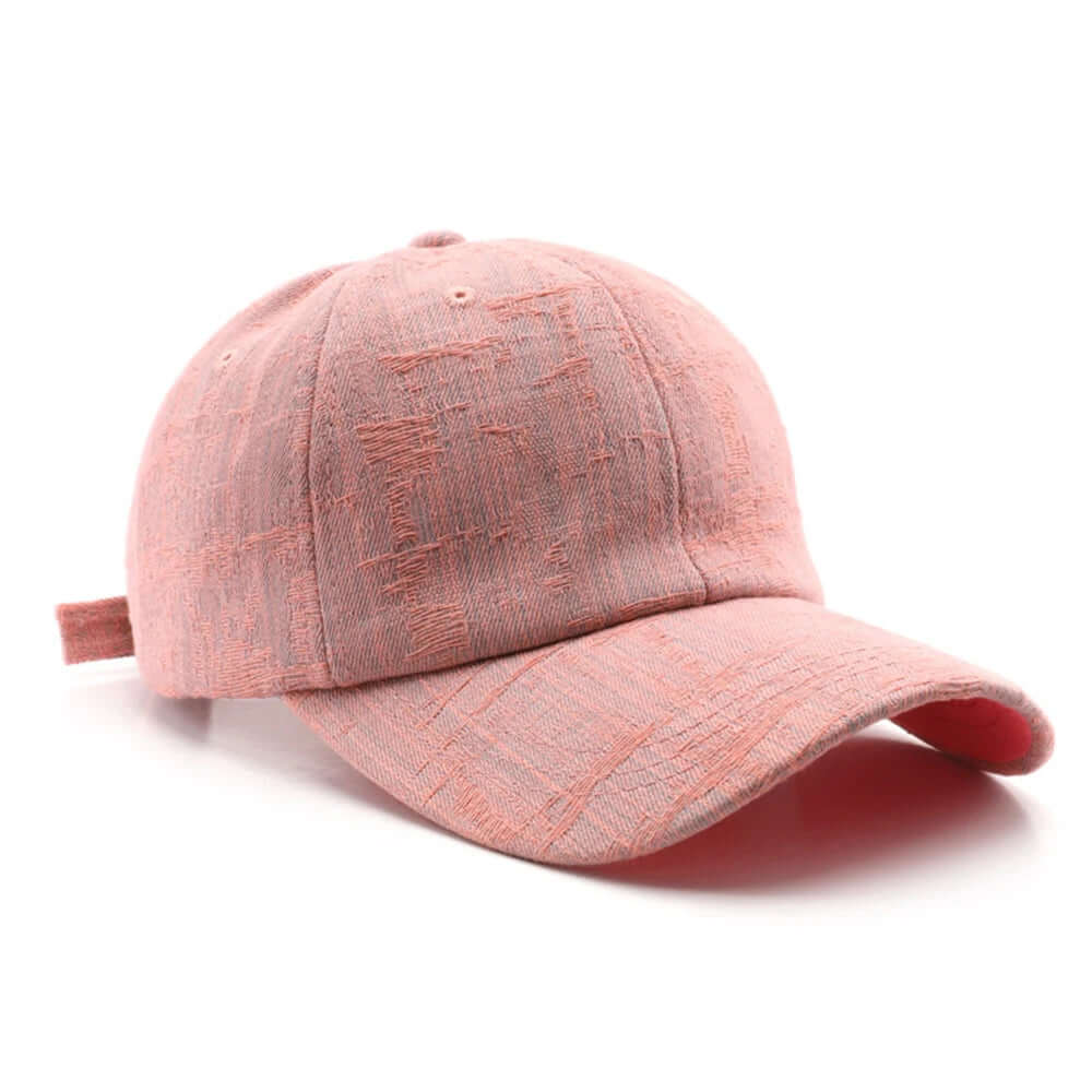 Wyatt Street denim cap in faded pink with a vintage wash and adjustable back strap for everyday style.