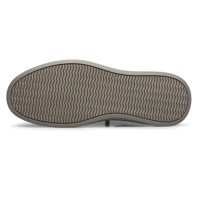 Bottom view of Ashton genuine leather sneakers, showcasing durable rubber outsole with detailed tread pattern.