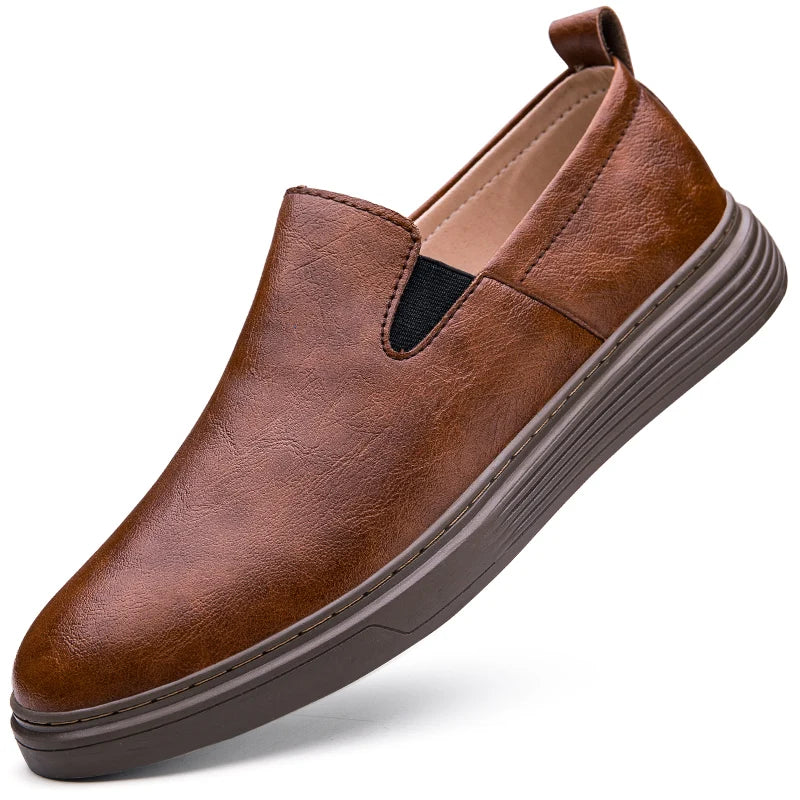 Duke Leather Slip-On Shoes in brown, featuring genuine leather, cushioned sole, and elastic side panels for easy wear.