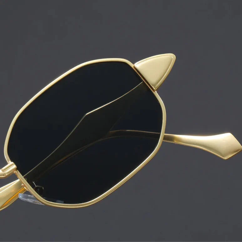 Atlas Alloy Sunglasses featuring unique geometric frames and sculpted gold metal arms.