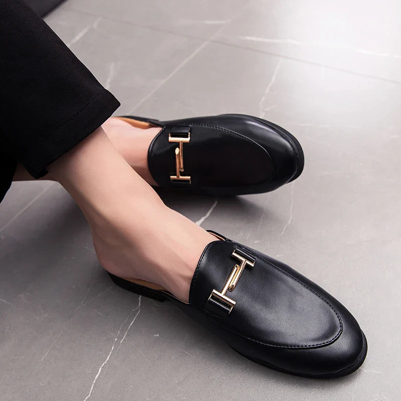 Santino Backless Slide Loafers with gold bit hardware, featuring a polished finish and open-back design for easy wear.