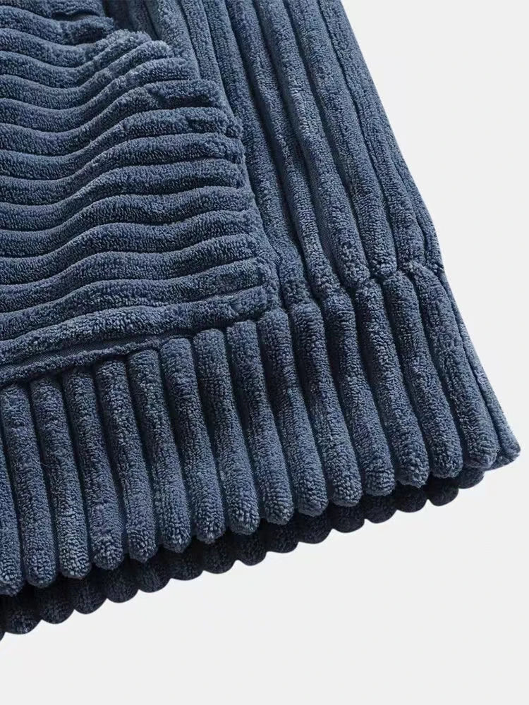 Close-up of the rich ribbed texture of the Summit Corduroy Hoodie showcasing its cozy fabric and relaxed fit.