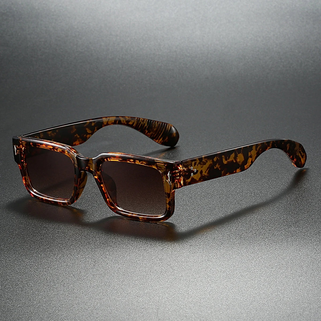 Stylish Monroe sunglasses with tortoise shell arms and clear fronts, offering UV protection and a modern-retro look.