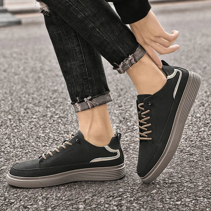 Genesis Leather Sneakers in black, featuring cushioned interior, lace-up design, and durable rubber sole for versatility.