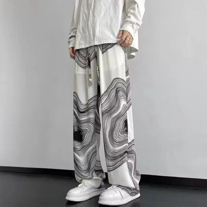 Wide-leg Vortex Ripple Pants with abstract print, lightweight fabric, and adjustable drawstring waist for effortless style.