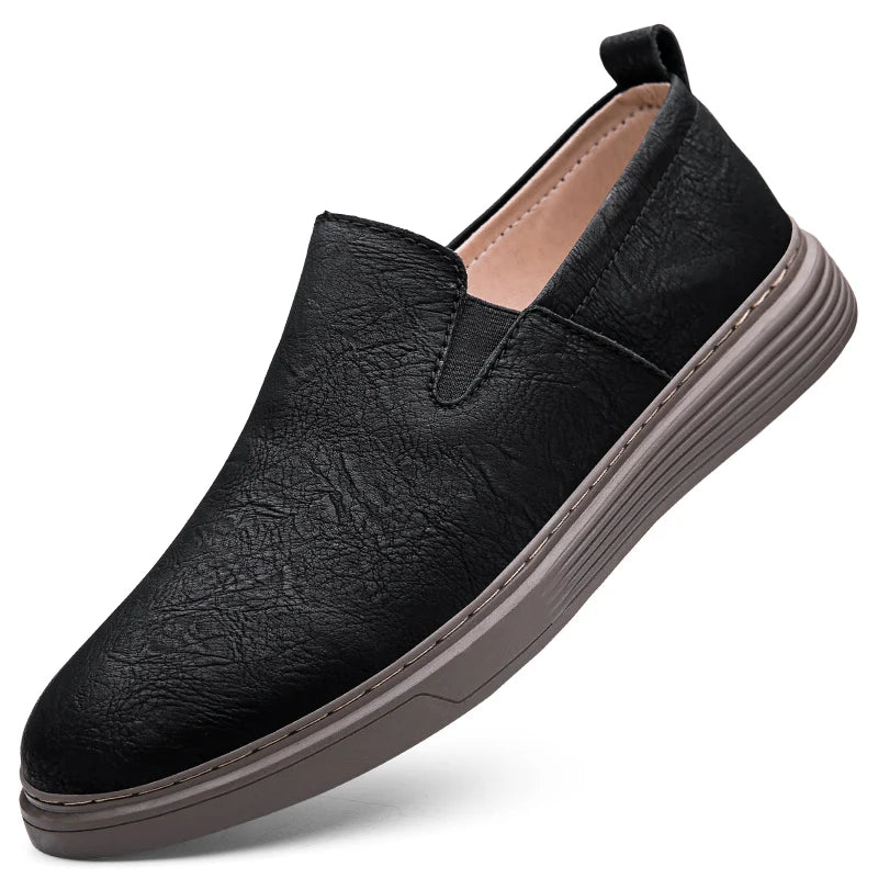 Duke Leather Slip-On Shoes in black, featuring cushioned sole and elastic side panels for comfort and style.