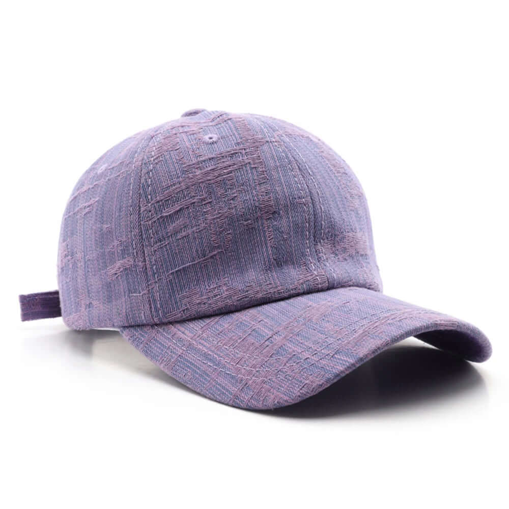 Wyatt Street Denim Cap in faded purple, featuring distressed details and an adjustable back strap for a custom fit.
